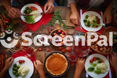 High Angle View Of Festive Table And People Eating